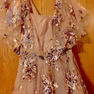 Long ,flared out, rose gold , cinched waist  dress